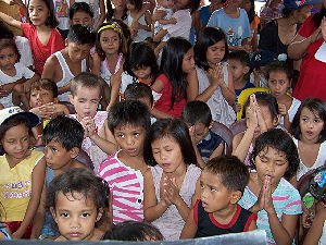 Children praying - Manila, Philippines