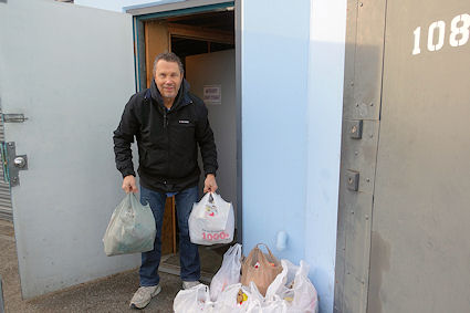Metro Kids Director, Rev. Graham Hanson loading donated turkeys.